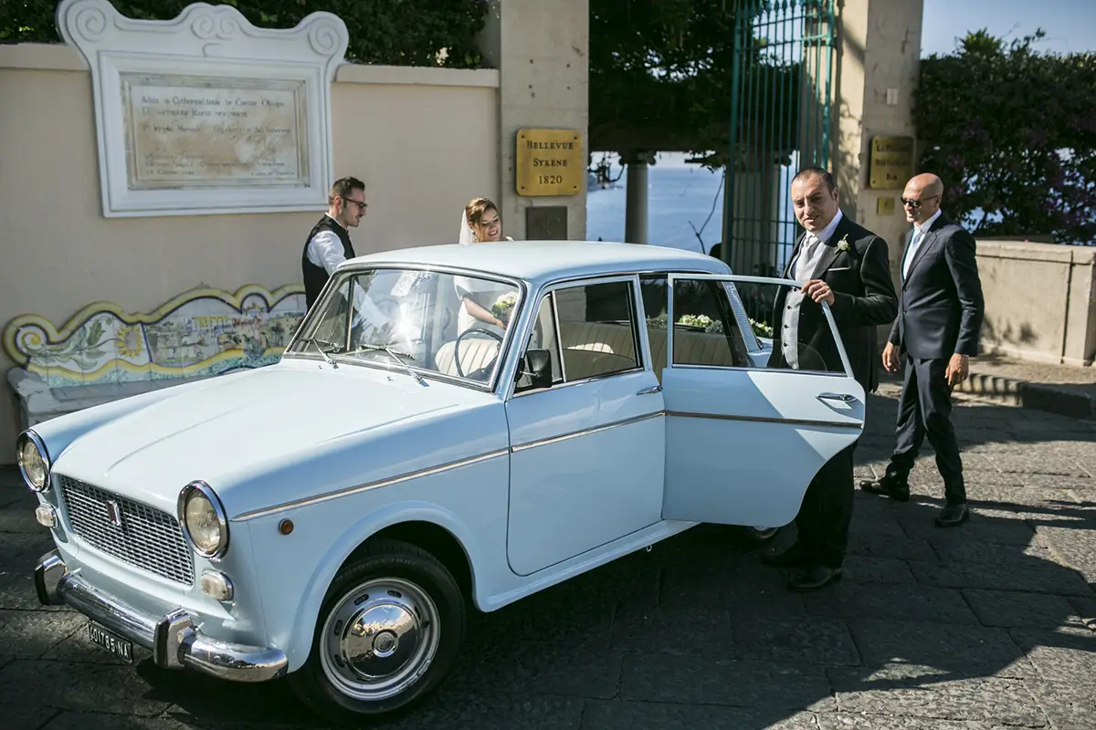 Bride and groom in a vintage car in Sorrento.